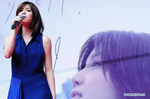 Actress Michelle Chen performs during a signing promotion event for her new album 