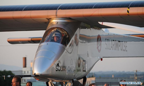 Solar Impulse arrives at its home base in Payerne, Switzerland, July 24, 2012. The world's biggest solar powered aircraft, Solar Impulse, on Tuesday touched down at its home base in Payerne, Switzerland, crossing the finish-line for its fuel-free intercontinental voyage. Photo: Xinhua