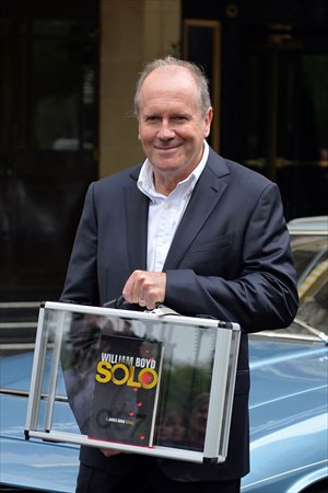 William Boyd poses with his new James Bond novel <em>Solo</em> during a photo call a day ahead of its release in central London on Wednesday. Photo: AFP