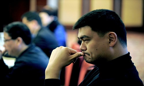 Retired Chinese basketball great Yao Ming indulges in deep thought in Shanghai on Wednesday. Yao will head to Beijing to attend the first session of the 12th Chinese People's Political Consultative Conference (CPPCC). Yao, who is attending the conference for the first time, is one of 21 sports representatives at the CPPCC National Committee. Photo: CFP