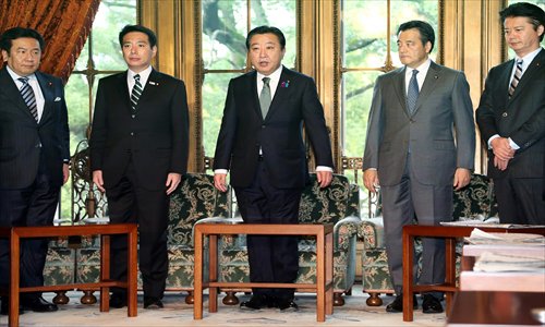  Japanese Prime Minister Yoshihiko Noda (center) speaks at a cabinet meeting at the National Diet in Tokyo on Tuesday. Photo: AFP 