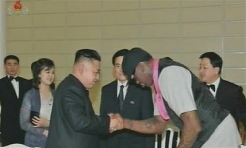 Kim Jong-un (left) shakes hands with Rodman.Photo: KCNA