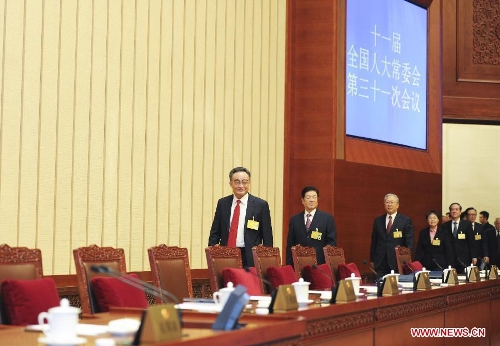 Wu Bangguo (front), chairman of the National People's Congress (NPC) Standing Committee, attends the closing ceremony of the 31st session of the 11th NPC Standing Committee in Beijing, capital of China, Feb. 27, 2013. (Xinhua/Xie Huanchi)  