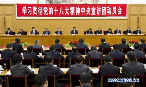 Liu Yunshan (C, back), a member of the Standing Committee of the Political Bureau of the Communist Party of China (CPC) Central Committee and member of the Secretariat of the CPC Central Committee, attends a meeting on a campaign to promote the spirit of the 18th CPC National Congress in Beijing, capital of China, November 22, 2012. Xi Jinping, general secretary of the CPC Central Committee, gave a written instruction to Thursday's meeting. (Xinhua/Huang Jingwen)