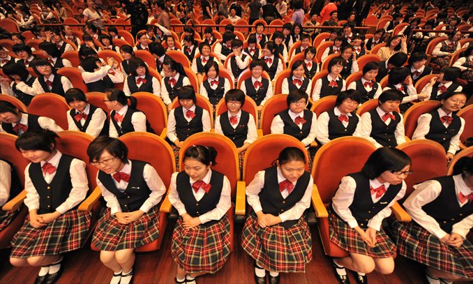 Students from the Hua Xia Girls' School, the only all-girls public school in Beijing, join its 15th founding anniversary celebration on May 18, 2011. Photo: CFP