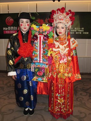 Hong Kong television personalities Si Ho Leung and Shum Po Yee perform a 'ghost wedding' on July 23 to promote their TV program about the supernatural. Photo: IC