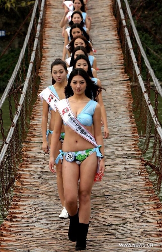 Contestants of the 37th Miss Bikini International Competition pose for a photo in Qixingyan scenery spot in Zhaoqing, south China's Guangdong Province, Jan. 10, 2013. The China final of the competition kicked off here on Jan. 9. (Xinhua/Li Mingfang) 