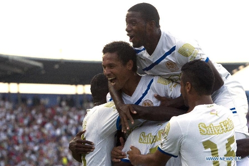 Players of Olimpia celebrate their victory against Real Sociedad after the final match of Honduran Soccer Clousure Tournament, held at Tegucigapa's National Stadium, in Tegucigalpa, Honduras, on May 19, 2013. (Xinhua/Rafael Ochoa)