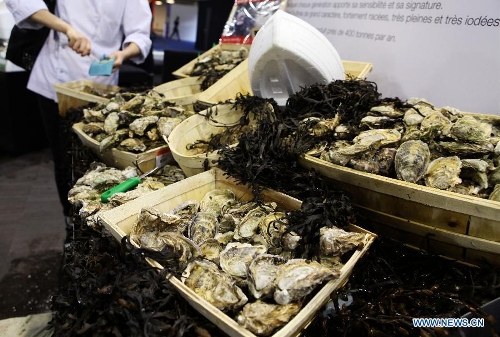 Oysters are seen at the International Hospitality and Food Service Fair (SIRHA) in Lyon, France, on Jan. 30, 2013. The five-day fair was closed on Wednesday. The biyearly SIRHA was founded in 1984 and is considered one of the most influential food expos in Europe. (Xinhua/Gao Jing)