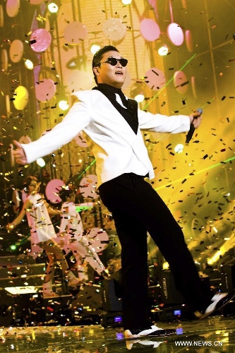 South Korean singer Psy dances as he sings his hit single 
