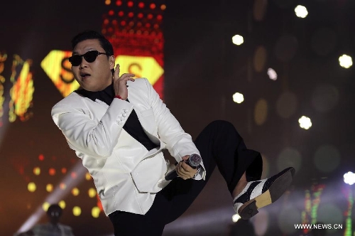 South Korean singer Psy dances as he sings his hit single 