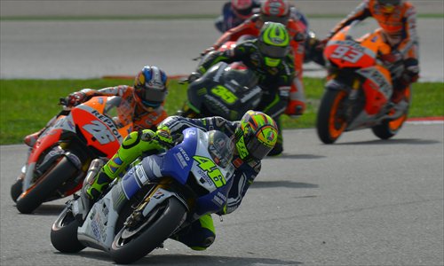 Racers take a corner during the 2013 Malaysian motorcycle Grand Prix at the Sepang circuit on October 13.
