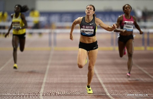 Czech Republic's Zuzana Hejnova (C) crosses the finish line in the women's 400 meters hurdles during the IAAF Diamond League Athletics meet in Shanghai, east China, May 18, 2013. Hejnova won the first place of the event in 59.79 seconds. (Xinhua/Li Jundong) 