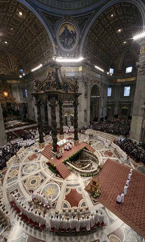 Priests kneel during a mass celebrated by Pope Francis during a priest's ordination ceremony on Sunday in St. Peter's Basilica at the Vatican. Photo: AFP
