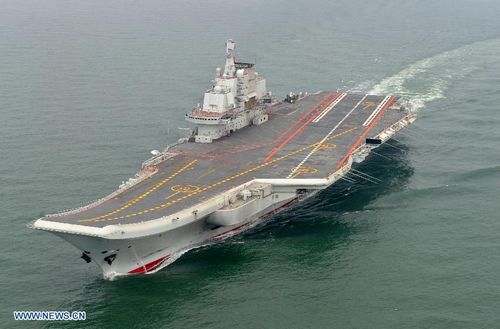 Photo taken in May 2012 shows a Chinese aircraft carrier cruising for a test on the sea. China's first aircraft carrier was delivered and commissioned to the Navy of the Chinese People's Liberation Army on September 25, 2012. The carrier, with the name 