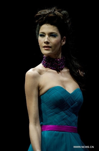 A model presents a creation of Indonesian brand Jeanny Ang Couture's 2013 spring/summer series at the 11th 