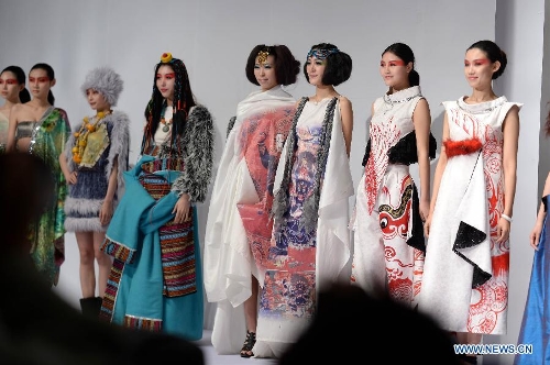 Models present traditional ethnic fashion creations during the 2013 China (Qingdao) International Fashion Week in Qingdao, a coastal city in east China's Shandong Province, May 5, 2013. (Xinhua/Li Ziheng)