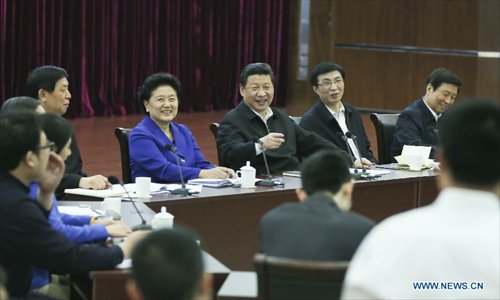 Chinese President Xi Jinping (back, C) talks at a discussion with representatives of model youth to mark the country's Youth Day on Saturday at China Academy of Space Technology in Beijing, capital of China, May 4, 2013. Xi on Saturday called on Chinese young people to contribute to the revitalization of the nation and 
