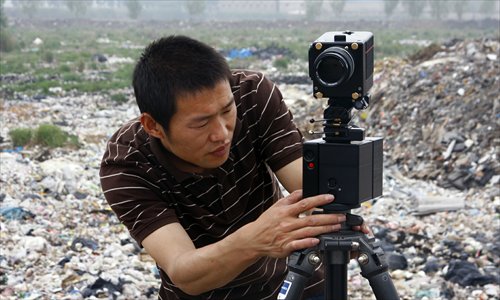 Photographer Wang Jiuliang focuses his camera on a garbage dump in Beijing. Photos: Courtesy of Wang Jiuliang