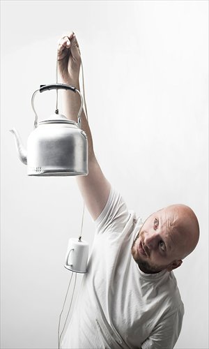 Jonas Merian holding a kettle-made lamp Photo: Courtesy of the artist