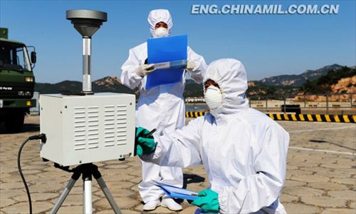 China’s first maritime CBRN (chemical, biological, radiological or nuclear) emergency rescue team under a submarine base of the North China Sea Fleet of the Navy of the Chinese People’s Liberation Army (PLAN) recently conducted the drill on such subjects as real-time monitoring, delineation of contaminated areas, sample collection and analysis, and decontamination of contaminated equipment, personnel and ground with new-type equipment in a sea area. (Chinamil.com.cn/ Yu Hang and Yu Haitao)