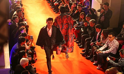 Models walk the runway in Han clothing at the opening of the 2013 World Etiquette Couture Festival on the Bund Tuesday night. Photo: Cai Xianmin/GT