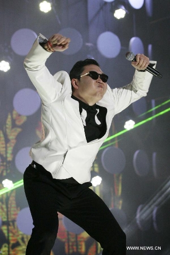 South Korean singer Psy dances as he sings his hit single 