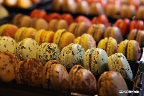 Photo taken on Jan. 30, 2013 shows macaroons displayed at the International Hospitality and Food Service Fair (SIRHA) in Lyon, France. The five-day fair was closed on Wednesday. The biyearly SIRHA was founded in 1984 and is considered one of the most influential food expos in Europe. (Xinhua/Gao Jing)