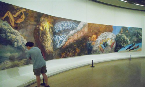 A viewer admires a piece by Yu Hong at the IN TIME: 2012 exhibition. Photo: Zhang Zihan/GT
