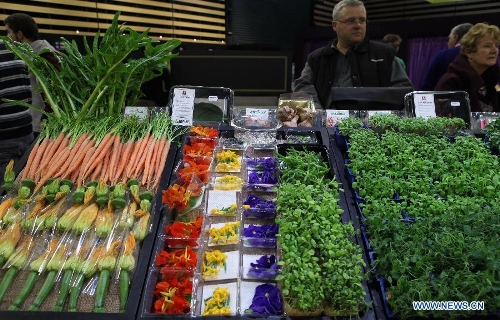Customers are seen at the International Hospitality and Food Service Fair (SIRHA) in Lyon, France, on Jan. 30, 2013. The five-day fair was closed on Wednesday. The biyearly SIRHA was founded in 1984 and is considered one of the most influential food expos in Europe. (Xinhua/Gao Jing)