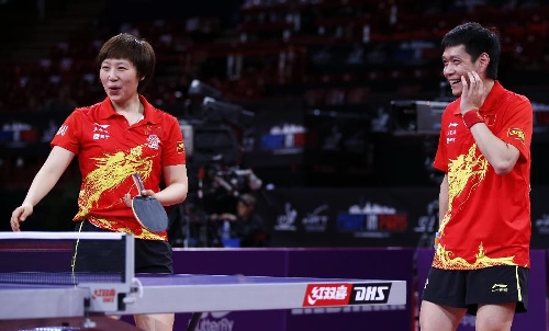 Qiu Yike (R) and Wen Jia of China react during the first round of mixed doubles against Gencay Menge and Ipek Karahan of Turkey at Palais omnisport de Paris Bercy in Paris, France, on May 14, 2013. Qiu and Wen won 4-0. (Xinhua/Wang Lili) 