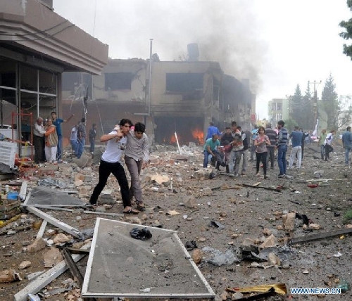 Photo taken on May 11, 2013 shows the site of an explosion in the town of Reyhanli, in the southern Turkish province of Hatay. At least 40 people were killed and 100 others injured after explosions shook a Turkish town on Saturday near the border with Syria, Turkish Interior Minister Muammer Guler said. (Xinhua/NTV) 