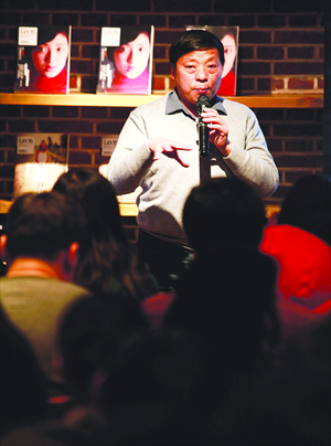 Lu Guang, a freelance photographer, shares his experiences and tells stories about taking photos over the last decade to fans in Beijing on December 20. Photo: CFP