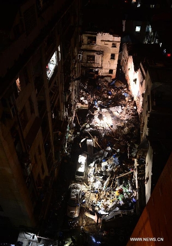  Photo taken on March 19, 2013 shows the blast locale of a residential building in Wuhan, capital of central China's Hubei Province. An explosion ripped through a residential building in Wuhan Tuesday night. Casualties from the blast that broke out at around 10 p.m. in Hanlai Square in the city's Hankou District are still unknown. (Xinhua/Cheng Min)