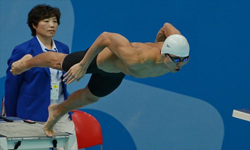 Ning Zetao starts his 50 meters freestyle final at the East Asian Games in Tianjin on Monday. Photo: Xinhua
