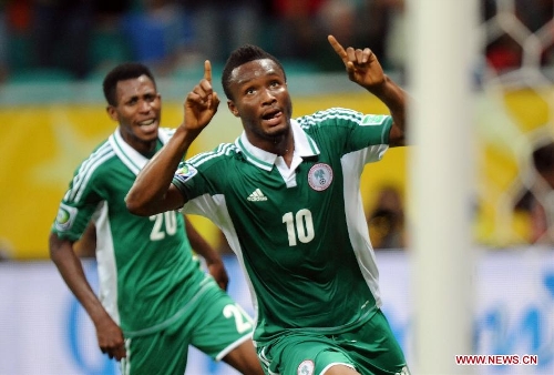 Nigeria's John Obi Mikel (Front) celebrates scoring during the FIFA's Confederations Cup Brazil 2013 match against Uruguay in Salvador, Brazil, on June 20, 2013. Uruguay won 2-1. (Xinhua/Nicolas Celaya)&nbsp; 