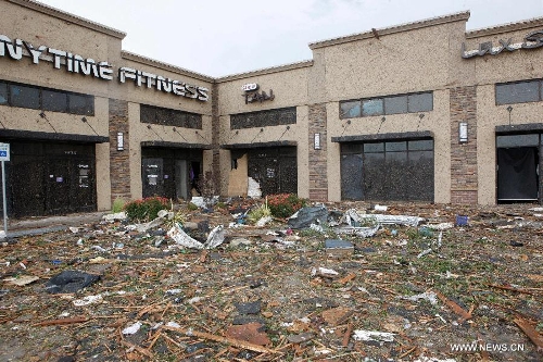 Piles of rubble are seen in Moore, Oklahoma, May 21, 2013, one day after a tornado moved through the area. A powerful tornado attacked on Monday afternoon the southern suburbs of the Oklahoma City, capital of the U.S. state of Oklahoma, killing at least 24 people, including 9 children. (Xinhua/Song Qiong)