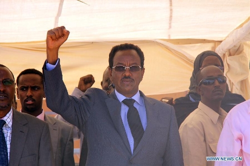 Somali Prime Minister Abdi Farah Shirdon (C) takes part in a rally in Mogadishu, Somalia, on Jan. 21, 2013. Hundreds have rallied on Monday to mark the United State administration's recognition of the Somali government following a state visit by Somalia's leader to the U. S. last week.(Xinhua/Faisal Isse)
