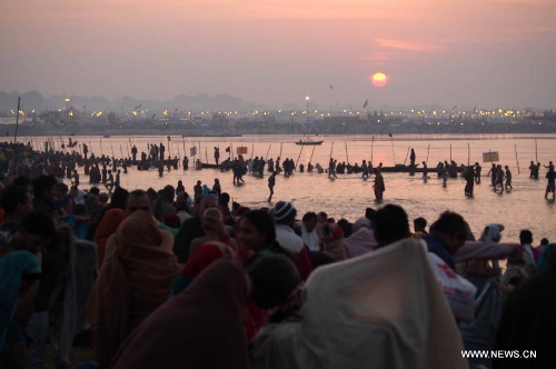 Indian devotees take bath in Triveni Sangam during Maha Kumbh Mela festival in Allahabad, a city in west uttar Predash, India, Jan. 27, 2013. (Xinhua/Li Yigang) 