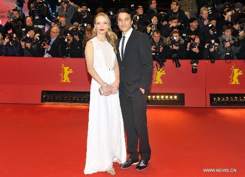 Actress Janin Reinhardt (L) and actor Kostja Ullmann pose on the red carpet for the screening of the film 