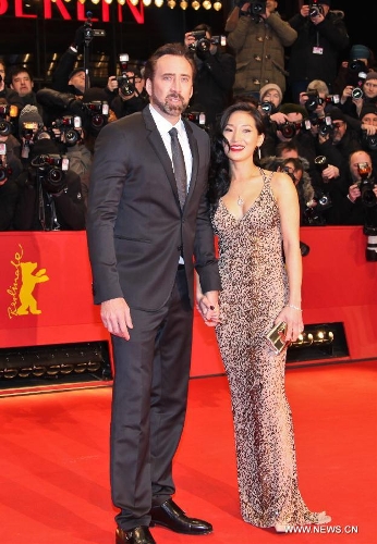 Actor Nicholas Cage and his wife Alice Kim pose on the red carpet for the screening of the film 