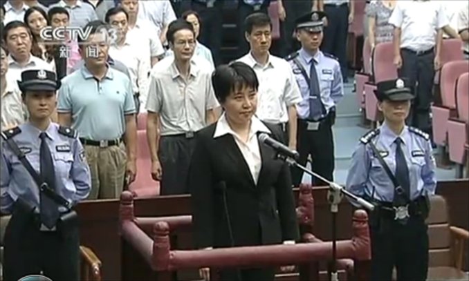 Bogu Kailai stands at the Intermediate People's Court in Anhui, Hefei Province as the judge read the verdict on Mondnay. She was sentenced to death with two years' reprieve for murdering a British businessman. Photo: AFP