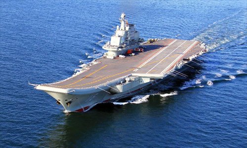 This undated photo shows China's first aircraft carrier, the Liaoning, sailing on the sea. China has successfully conducted flight landing on its first aircraft carrier, the Liaoning. After its delivery to the People's Liberation Army (PLA) Navy on Sept. 25, the aircraft carrier has undergone a series of sailing and technological tests, including the flight of the carrier-borne J-15. Capabilities of the carrier platform and the J-15 have been tested, meeting all requirements and achieving good compatibility, the PLA Navy said. Designed by and made in China, the J-15 is able to carry multi-type anti-ship, air-to-air and air-to-ground missiles, as well as precision-guided bombs. The J-15 has comprehensive capabilities comparable to those of the Russian Su-33 jet and the U.S. F-18, military experts estimated. Photo: Xinhua