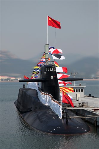 Sailors from China's North China Sea Fleet stand on top of a nuclear submarine during a military drill on Sunday. Central China Television broadcast the drill on its 7 pm news program, hailing the establishment of the country's very first nuclear submarine team. Photo: CFP