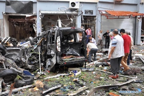 Photo taken on May 11, 2013 shows the site of an explosion in the town of Reyhanli, in the southern Turkish province of Hatay. At least 40 people were killed and 100 others injured after explosions shook a Turkish town on Saturday near the border with Syria, Turkish Interior Minister Muammer Guler said. (Xinhua/NTV) 