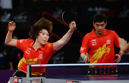 Qiu Yike (R) and Wen Jia of China compete during the first round of mixed doubles against Gencay Menge and Ipek Karahan of Turkey at Palais omnisport de Paris Bercy in Paris, France, on May 14, 2013. Qiu and Wen won 4-0. (Xinhua/Tao Xiyi) 