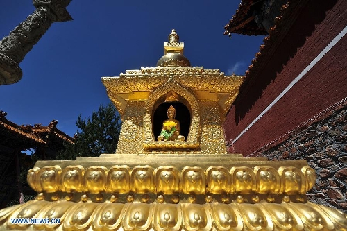 Photo taken on June 26, 2013 shows a pagoda on Mount Wutai, one of four sacred Buddhist mountains in China, in north China's Shanxi Province. Added to UNESCO's World Heritage List in 2009, Mount Wutai is home to about 50 Buddhist temples built between the 1st century AD and the early 20th century. (Xinhua/Zhan Yan) 