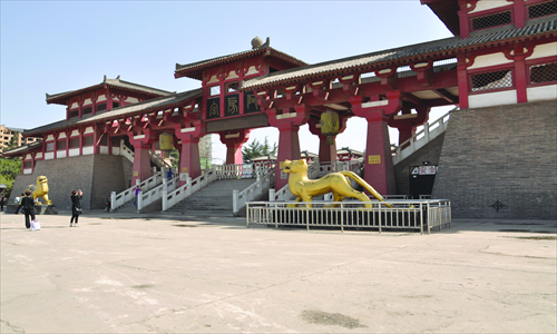 Several tourists stand in front of the reconstructed Epang Palace on Tuesday afternoon. Photo: Wang Nan/GT