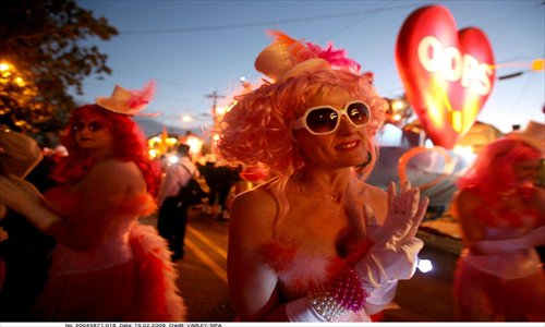 A procession of the Krewe of Muses