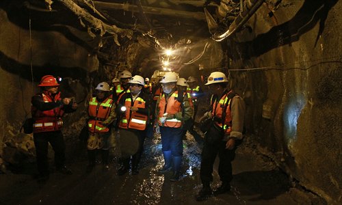 This handout photo received on Sunday shows officials of Freeport Indonesia inspecting the tunnel in Timika at the Grasberg mine, one of the world's biggest gold and copper mines high in the mountains of rugged Papua province.  Twelve workers have been confirmed dead after a mine tunnel collapse in eastern Indonesia, but 16 others are still unaccounted for five days after the accident, the US operator Freeport McMoRan said on Sunday. Photo: AFP